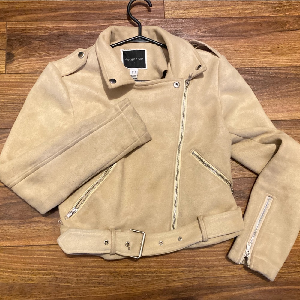 Mid condition jacket with silver buckles and zips